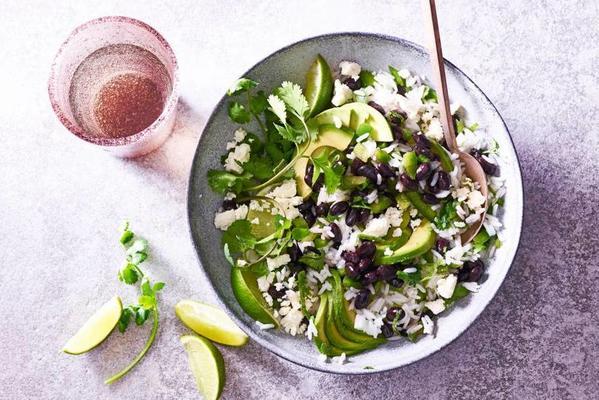 black beans rice salad with avocado and white cheese