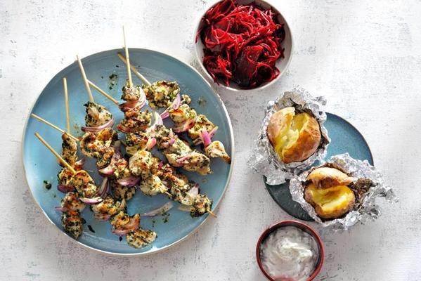 chicken skewers with baked potato and beetroot salad