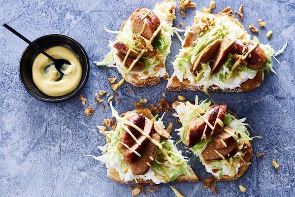 open sandwich with sausage and mustard