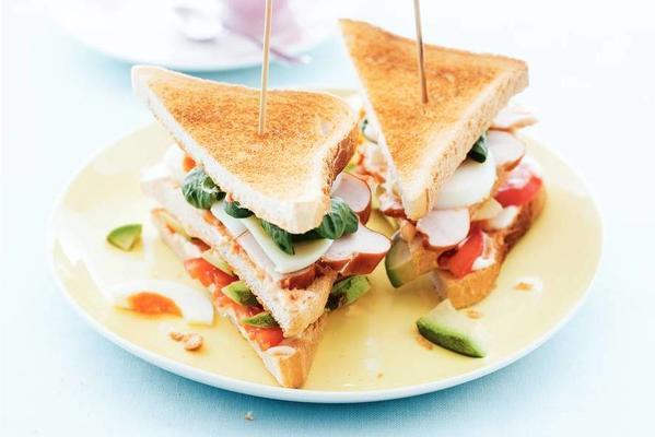 club sandwich with egg, chicken and avocado