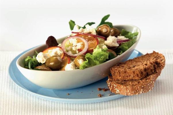 mixed salad with white cheese, olives and nectarine