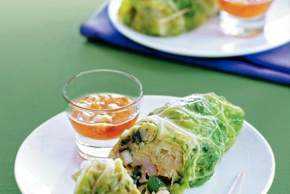 green cabbage rolls with fish and shrimps
