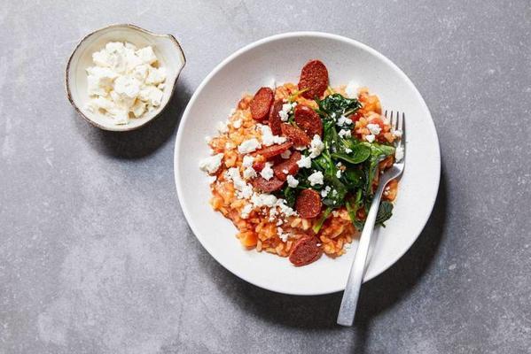 tomato risotto with chorizo, spinach and white cheese