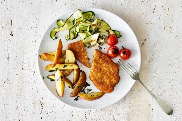 oven-roasted potatoes with vegaschnitzel and zucchini