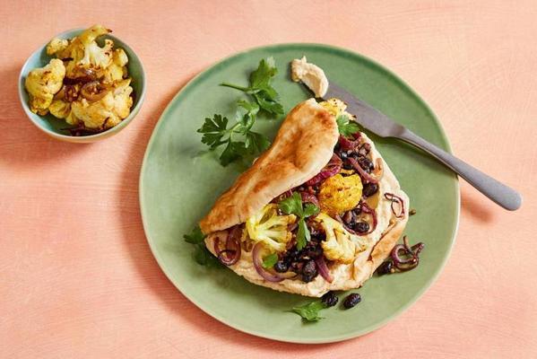 flatbreads with baked black beans, spiced cauliflower and hummus