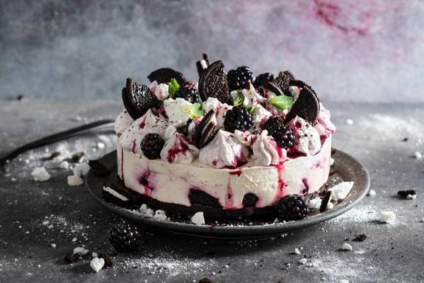 eton mess cheesecake with blackberry cream and oreo bottom