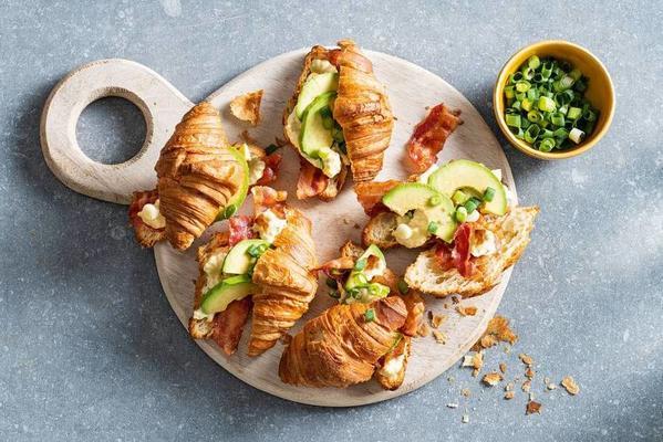 croissant filled with avocado and egg salad
