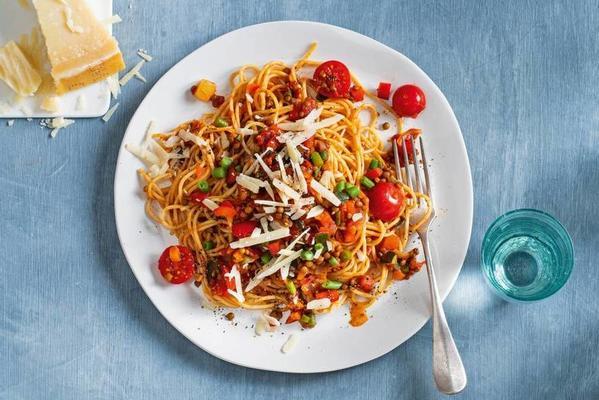 spaghetti with lentil-tomato sauce and parmesan cheese