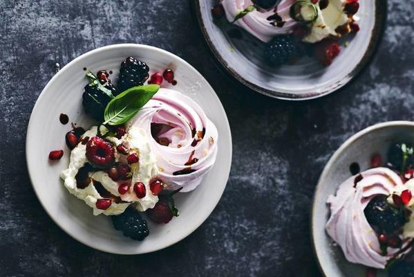 meringues with marinated blackberries, pomegranate seeds and raspberries