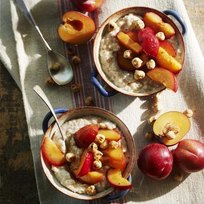 oatmeal with candied plums, honey and chopped nuts