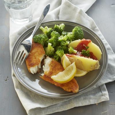 spicy fish schnitzel with baked potato