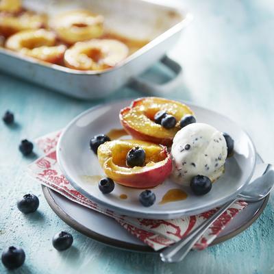 roasted peach with stracciatella ice cream and blueberries