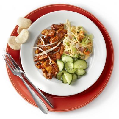 hot chicken with krupuk and cucumber