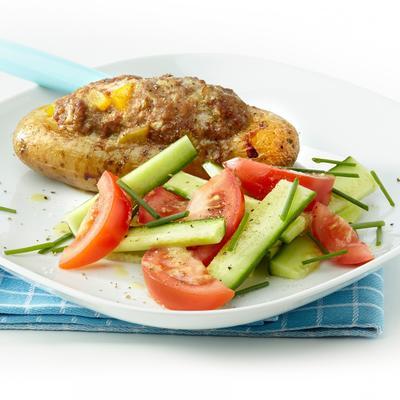 stuffed potato with minced meat and salad