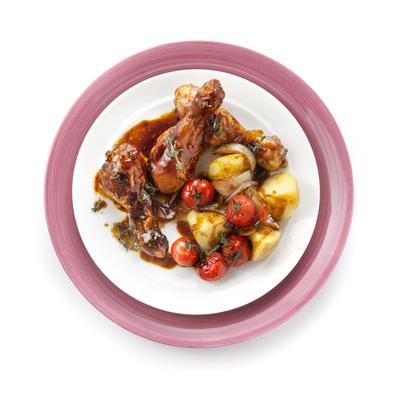 drumsticks with vine tomatoes and baked potato