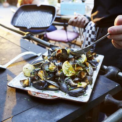 mussels from the barbecue with herb butter