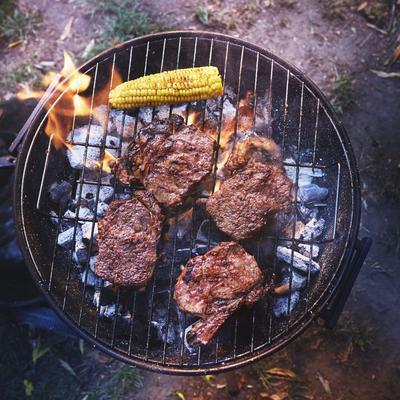 sirloin steak with jerk sauce and grilled corn