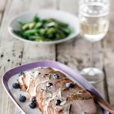 ham with rosemary sauce and blueberries