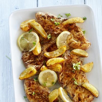 schnitzel with lemon butter sauce and paprika potatoes