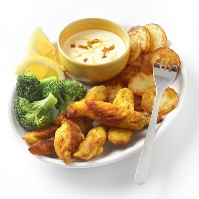 chicken fingers with baked potatoes and lemon sauce