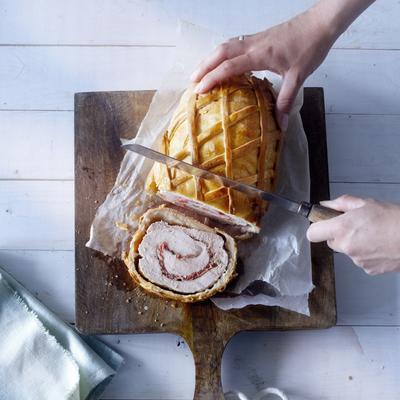 turkey roulade in dough with parma ham and raspberries