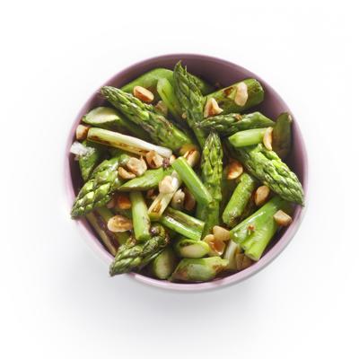 green asparagus salad with spring onion and hazelnuts