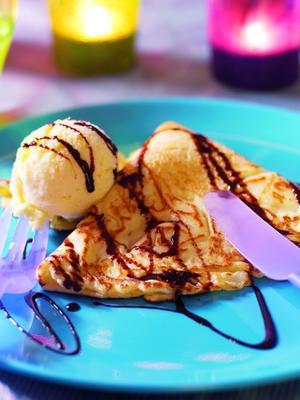 pancakes with vanilla ice cream and chocolate sauce
