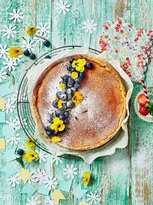 lemon tart with blue berries and rosemary