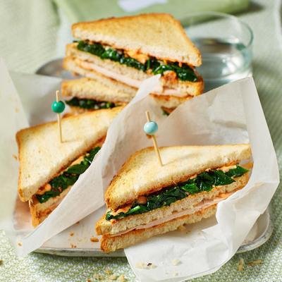 club sandwich with stir-fried spinach and chicken