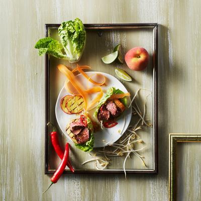 lettuce trays with steak, peach and sesame dressing