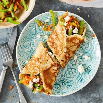 pancake roll with feta and raw vegetables