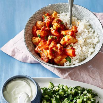 Indian fish curry with spicy cucumber salad