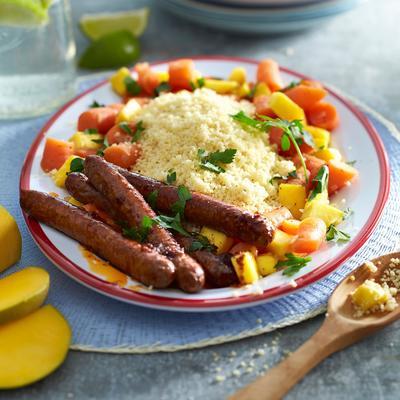 couscous with stewed carrot, mango and sausages
