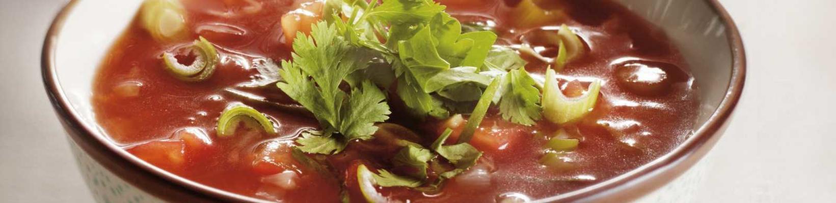 tomato broth with spring onion and coriander