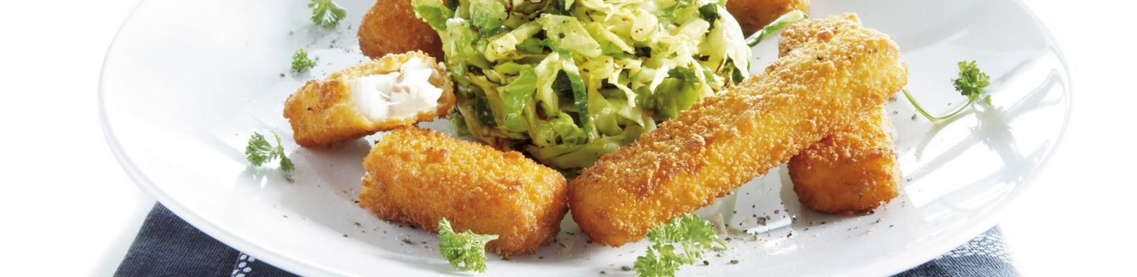 fish fingers on stir-fry of green cabbage