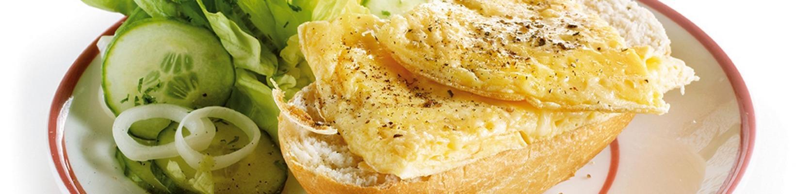 cheese omelette with cabbage lettuce and baguette