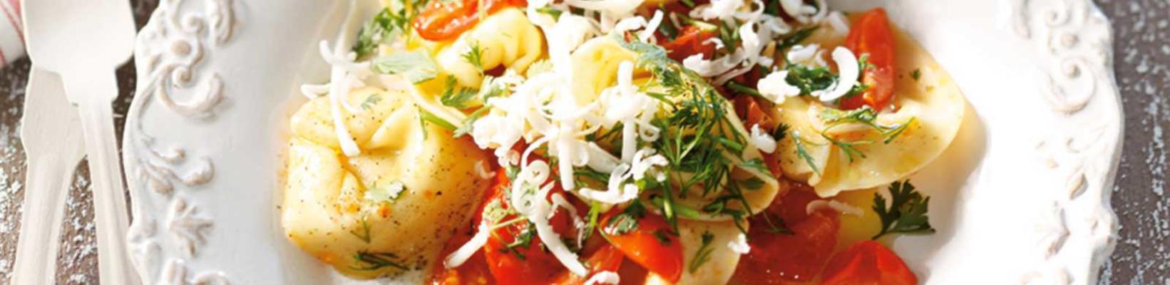cheese tortellini with cherry tomatoes, olive oil and fresh herbs