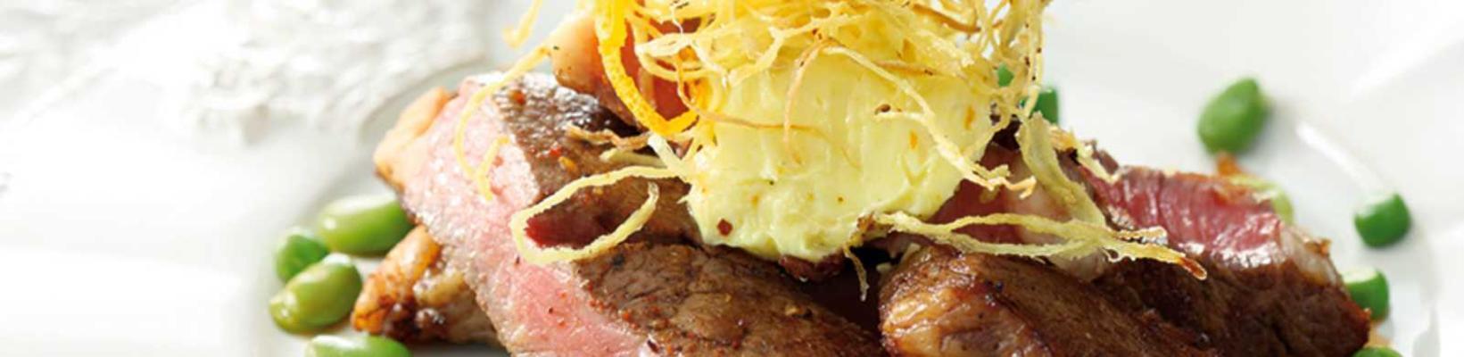 grilled argentinian steak with orange butter and fried ginger
