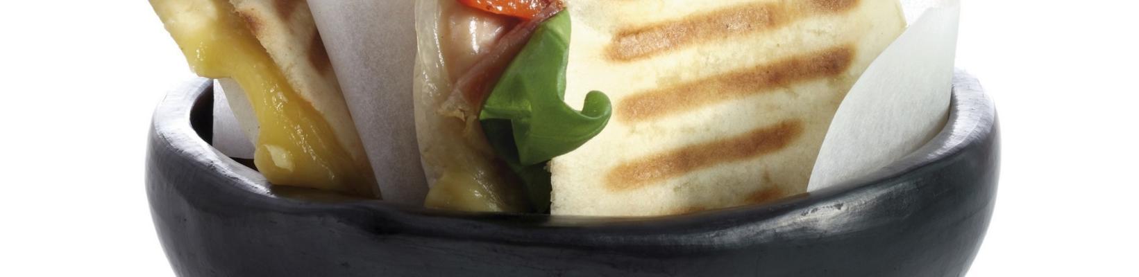 pita tosti with cheese, parma ham and roasted peppers