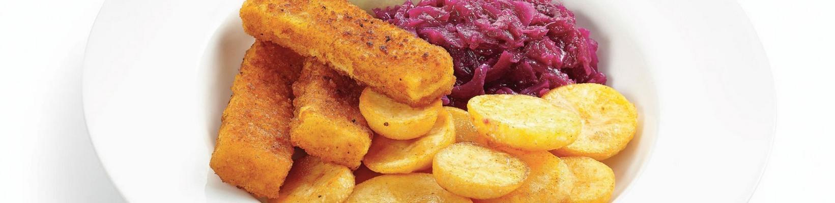 fish fingers with potato slices and red cabbage with apples