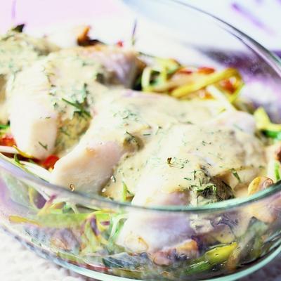 fish fillets on a bed of leeks and peppers with dill mustard sauce