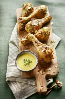 drumsticks with curry-almond sauce