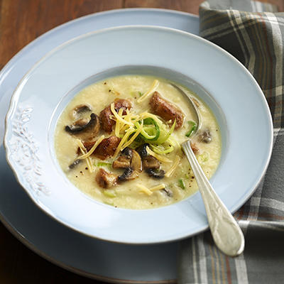 winter celeriac meal soup with sausages and mushrooms