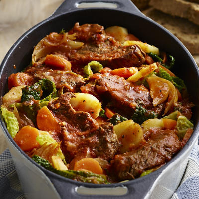 wintery beef stew with green cabbage and carrot