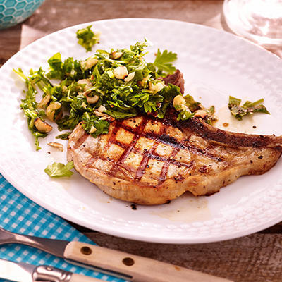 shoulder chops with hazelnut-herb salsa on the barbecue