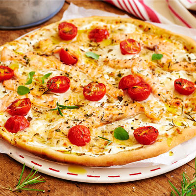 white pizza with salmon and herbs