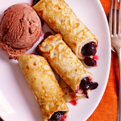 pancakes filled with red fruit compote and chocolate ice cream