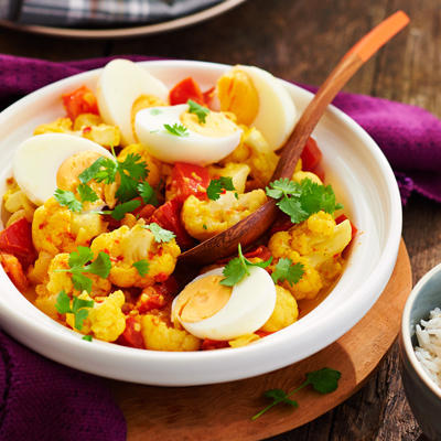 stewed cauliflower curry with tomato and egg