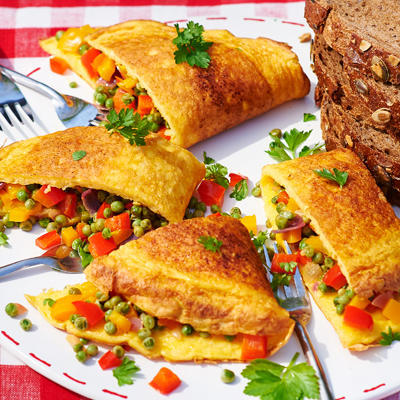 cheese omelette filled with peppers and peas