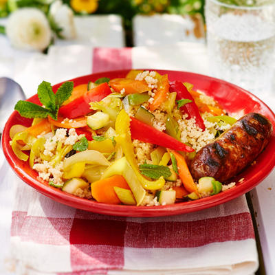 couscous with summer vegetables and grilled lamb sausages